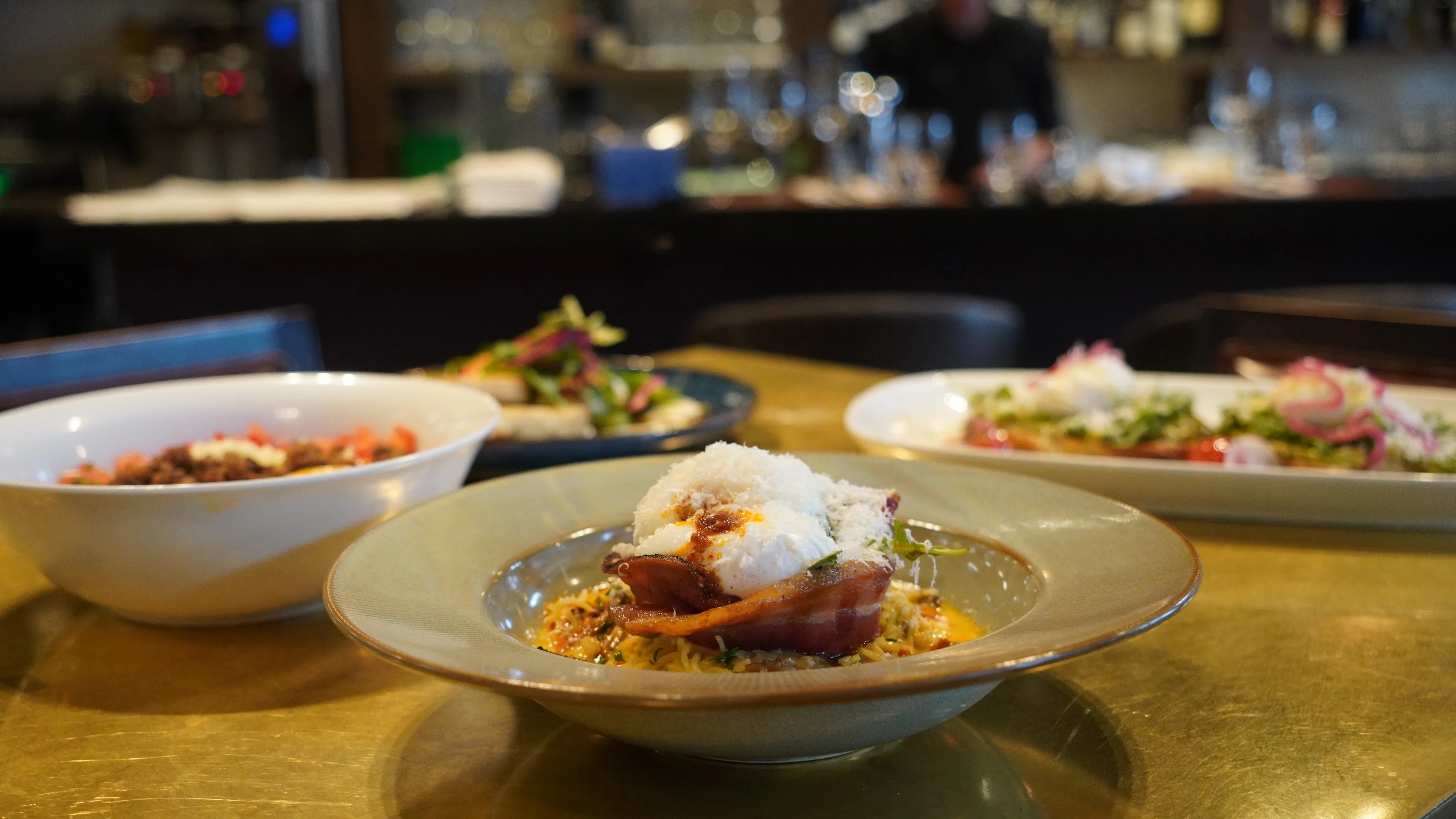 Brunch plates on the bar at notable - The Steakhouse, a Canadian steakhouse in Montgomery, Calgary